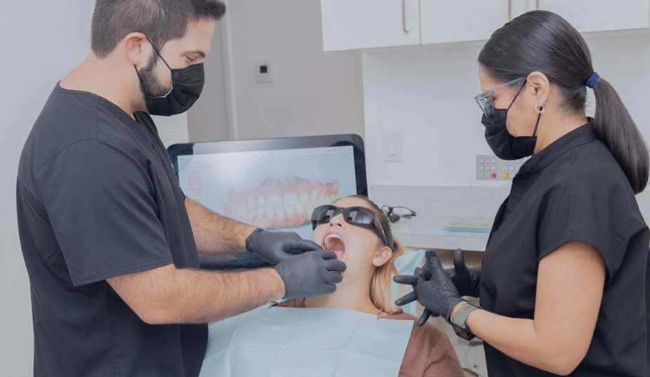 Emergency dentist in Miami reviewing treatment with a patient in Coral Gables